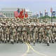 Troops march on the Memorial Bridge across the Potomac River.